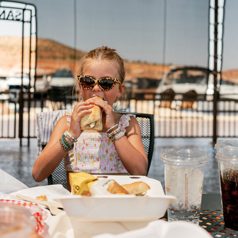 Girl eating at Antelope Point Restaurant at Lake Powell
